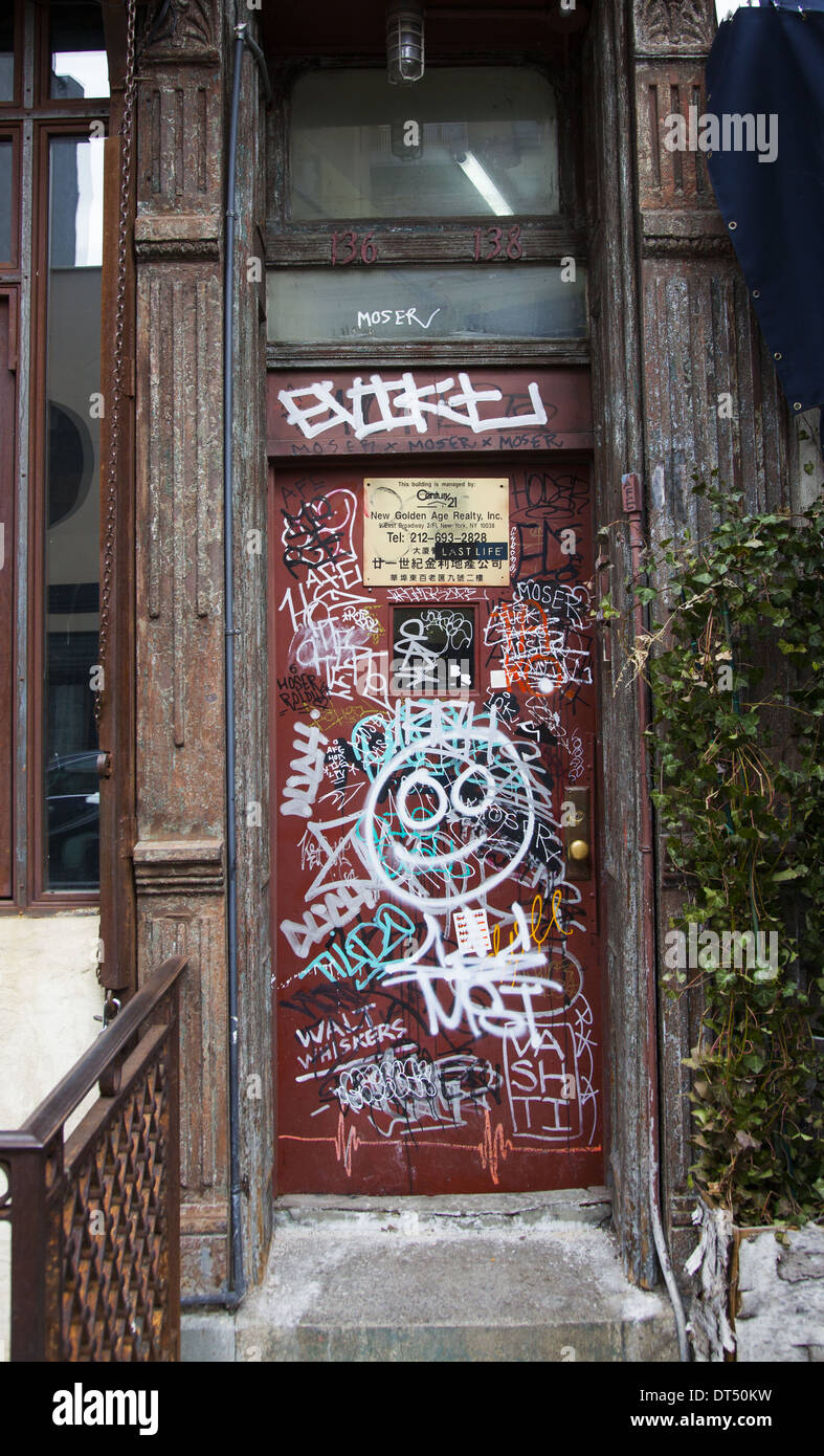 Graffiti marked apartment building walkup on the lower east side of Manhattan, NYC. Stock Photo