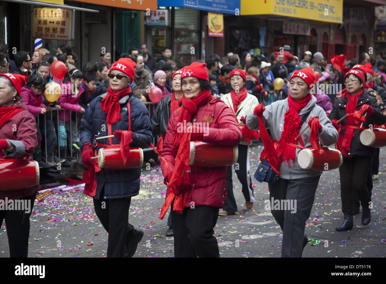 Older Chinese woman's group march in the Chinese New Year Parade in Chinatown, NYC. Stock Photo