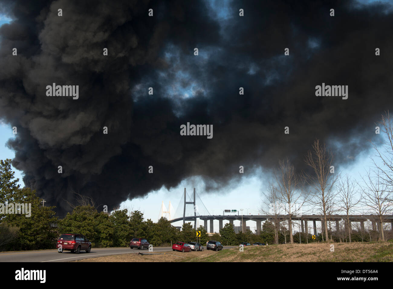 Savannah, Georgia, USA. 8th Fen, 2014. A warehouse fire at the Port of Savannah sends black smoke over Savannah, Georgia, U.S.A., on Saturday, February 8, 2014. Firefighters worked to contain and extinguish the blaze that erupted at the port’s Ocean Terminal not far from downtown Savannah. Credit:  JT Blatty/Alamy Live News Stock Photo