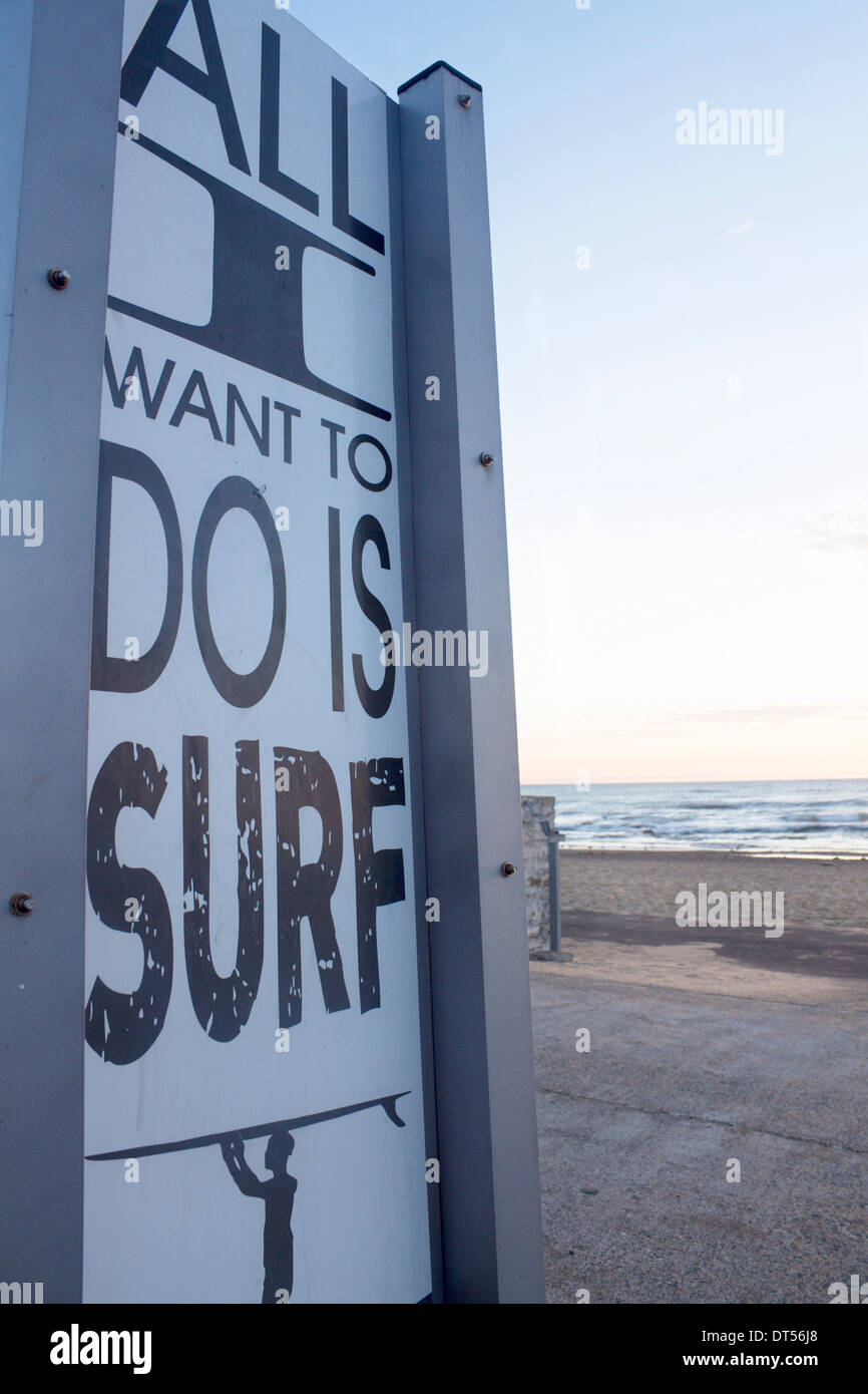 'All I Want To Do Is Surf' poster next to Merewether beach Newcastle NSW Australia Stock Photo