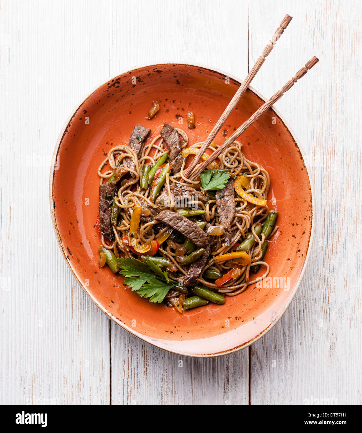 Fried noodles Yakisoba with beef on red plate Stock Photo
