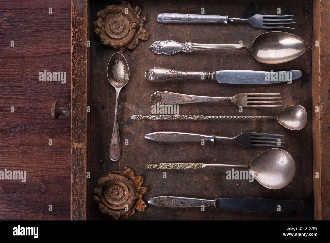 Old cutlery in an old wooden box with copy space Stock Photo