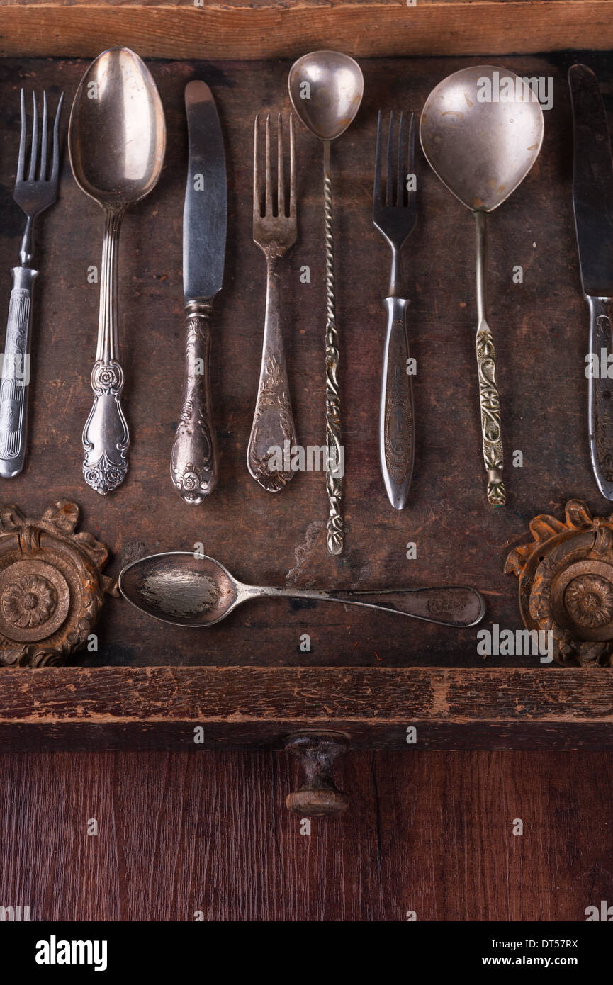 Old cutlery in an old wooden box with copy space Stock Photo