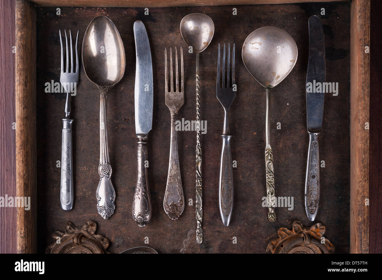 Old cutlery in an old wooden box Stock Photo