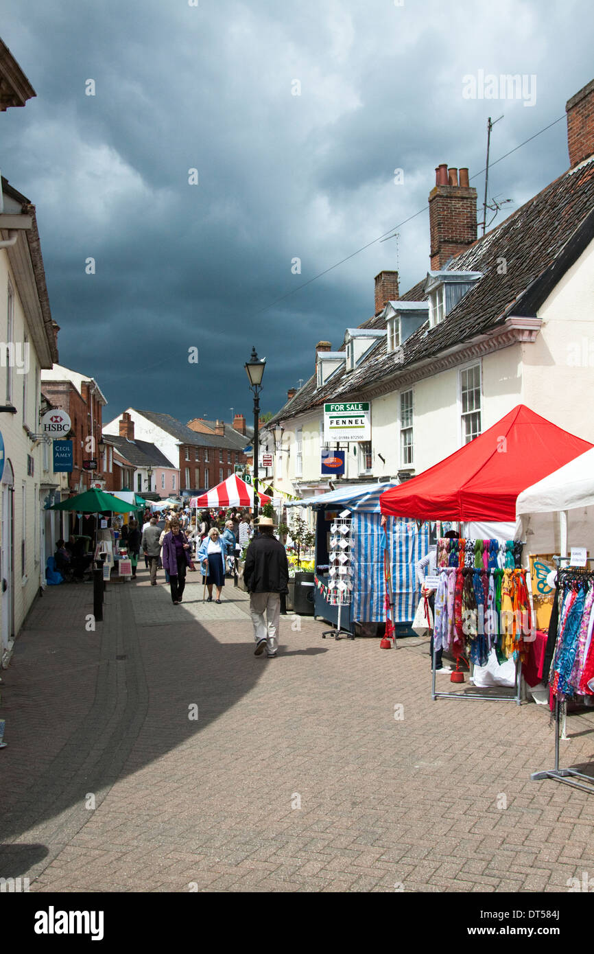 Street market in Halesworth, Suffolk with a rain storm approaching Stock Photo
