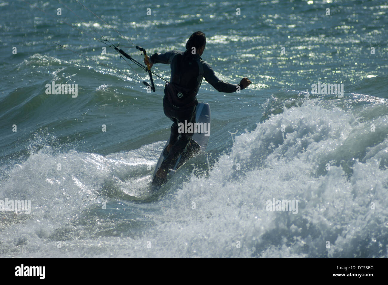 A kitesurfer enjoying the waves and fresh wind at Tarifa, Spain Stock Photo