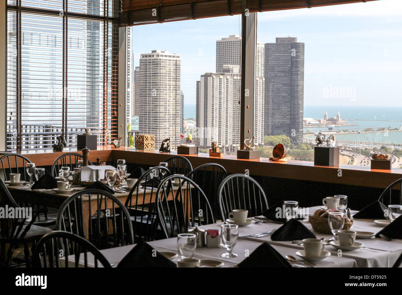 Looking over the tables of the Cliff Dwellers Club towards skyscrapers and Lake Michigan, Chicago Stock Photo