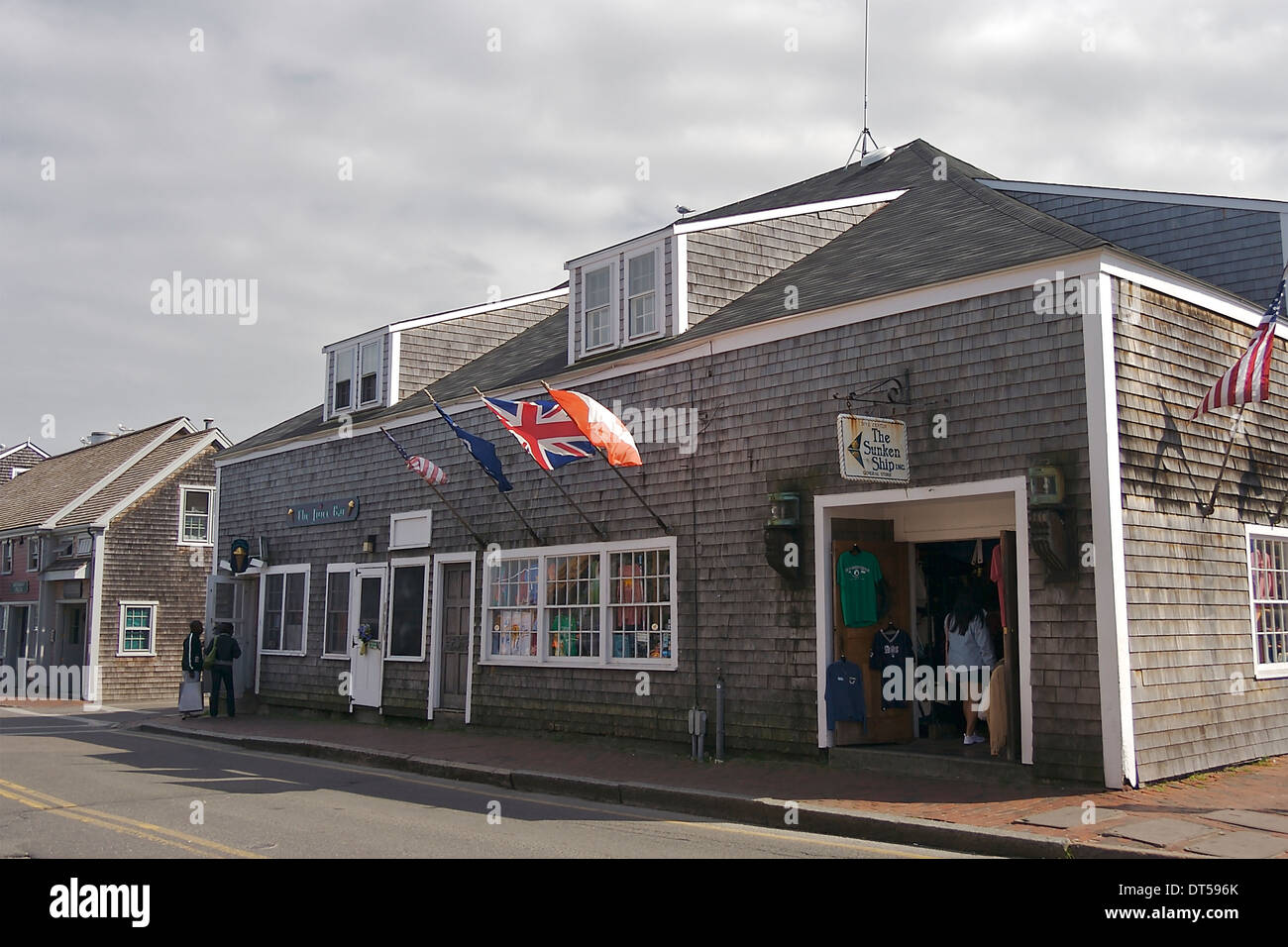 A shingled building housing a gift shop and juice bar on a street on Nantucket, Massachusetts Stock Photo