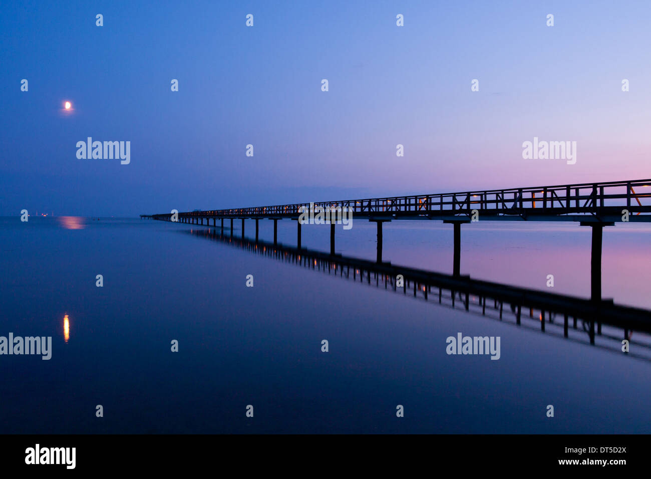 An after-sunset view of the Långa bryggan (Long Bridge), a remarkably long bathing pier in Bjärred, Sweden. Stock Photo