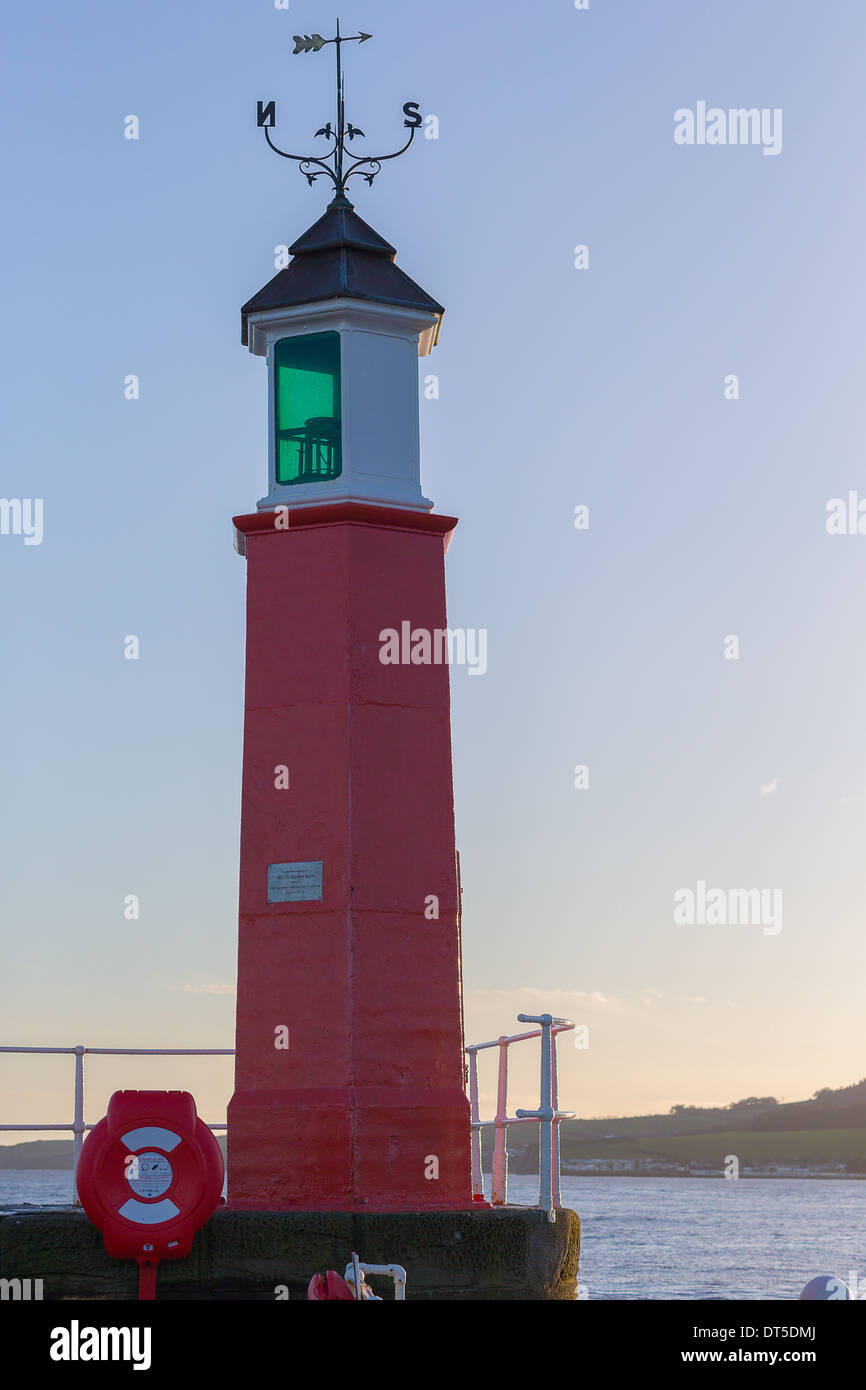 Watchet Harbour entrnace lighthouse between winter storms on a calm morning Stock Photo