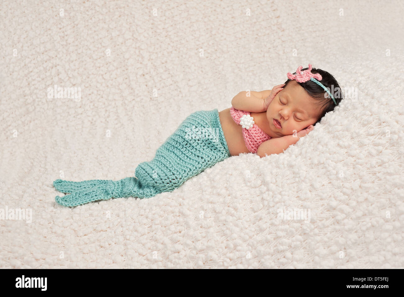 Newborn Baby Girl Wearing a Mermaid Costume Stock Photo
