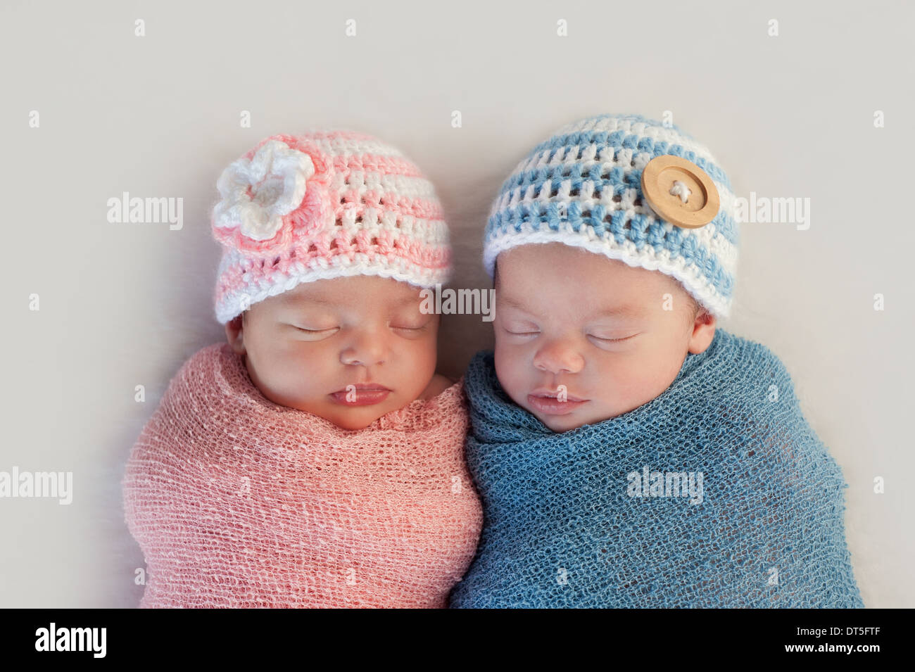 Boy and girl fraternal twin newborn babies Stock Photo