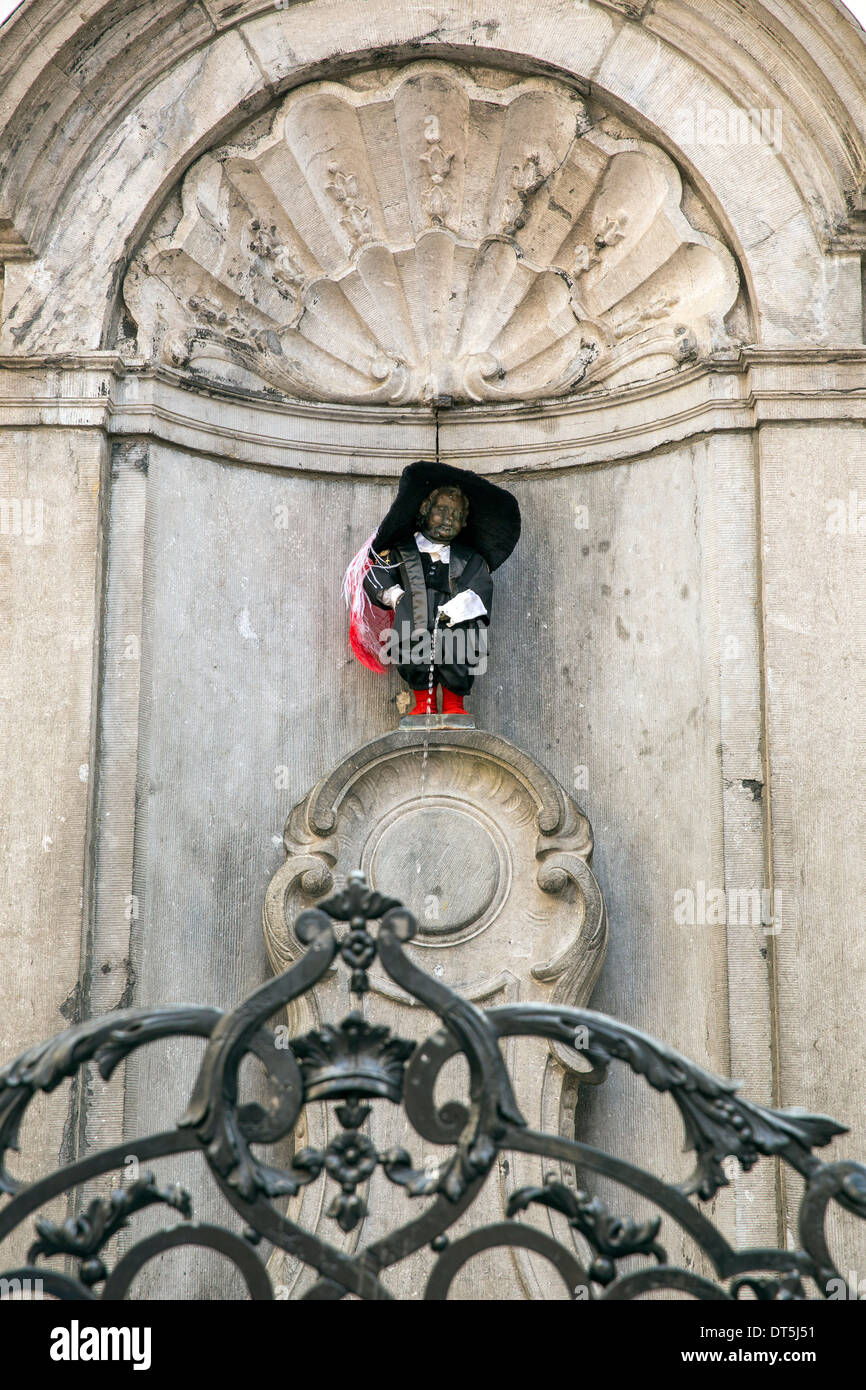 The iconic Manneken Pis statue in Brussels dressed in the costume of the Crossbowmen of Notre Dame Au Sablon. Stock Photo