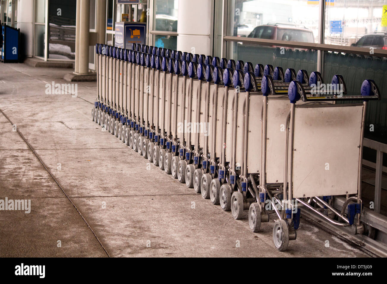 Rear view of a row baggage carts at Terminal 3 at Pearson International Airport in Toronto Ontario Canada Stock Photo