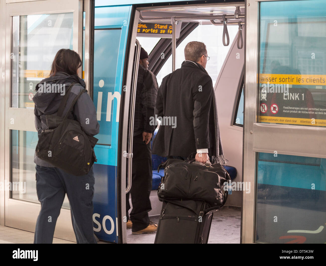 People boarding the LINK shuttle train at Pearson International Airport in Toronto, Ontario, Canada Stock Photo