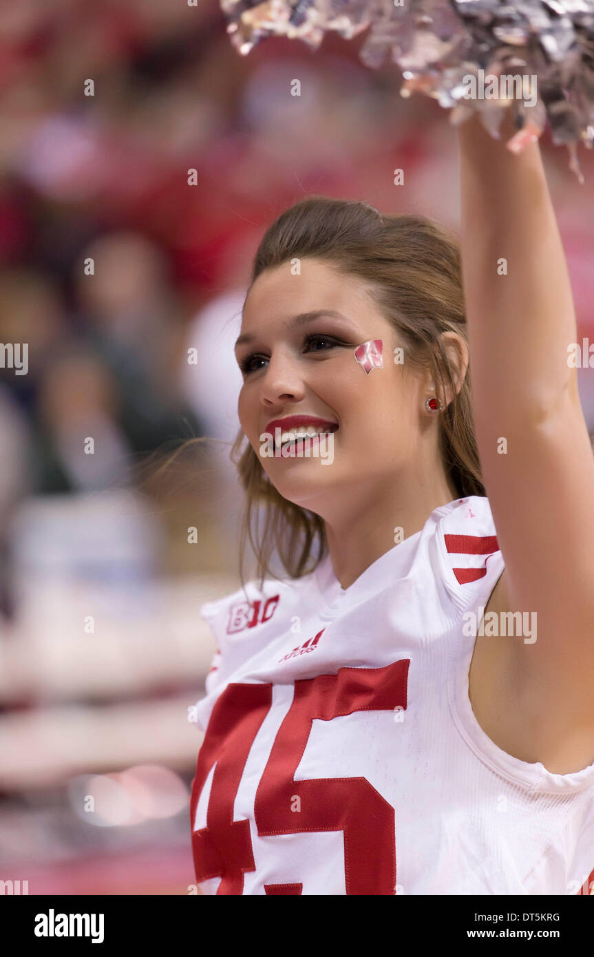 Madison, Wisconsin, USA. 9th Feb, 2014. February 9, 2014: Wisconsin Badgers cheerleader entertains crowd during the NCAA Basketball game between the Michigan State Spartans and the Wisconsin Badgers at the Kohl Center in Madison, WI. Wisconsin defeated Michigan State 60-58. John Fisher/CSM/Alamy Live News Stock Photo