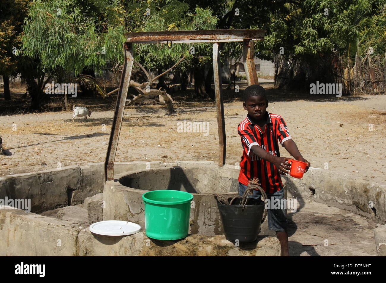 Dakar, Senegal. 4th Feb, 2014. A boy stands beside a well in a village of Jola people, in Casamance, southern Senegal, Feb. 4, 2014. The Jola (Diola, in French transliteration) is an ethnic group in Senegal, where they predominate in the region of Casamance. The Jolas are believed to have migrated to Casamance before the 13th century and kept a traditional lifestyle till now. © Tai Jianqiu/Xinhua/Alamy Live News Stock Photo