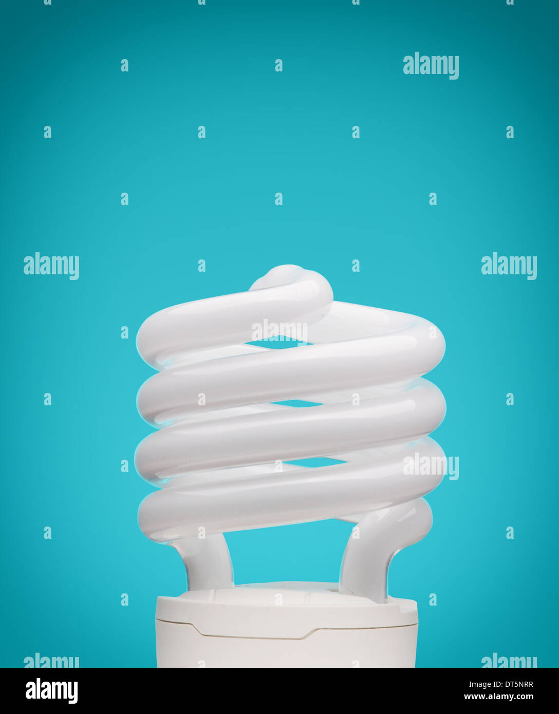 Energy saving light bulb on blue background Stock Photo - Alamy