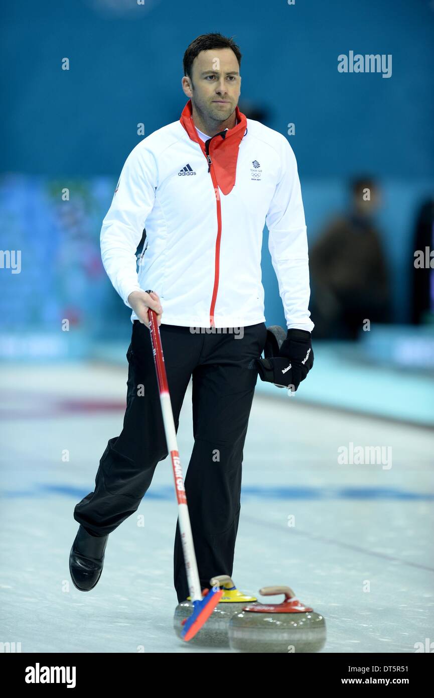 Sochi, Russia. 10th February 2014. David Murdoch (GBR) tidies the rink at the end of the match. Mens Curling - Iceberg Arena - Olympic Park - PHOTO: Mandatory by-line: Garry Bowden/SIPPA/Pinnacle - Credit:  Sport In Pictures/Alamy Live News Stock Photo