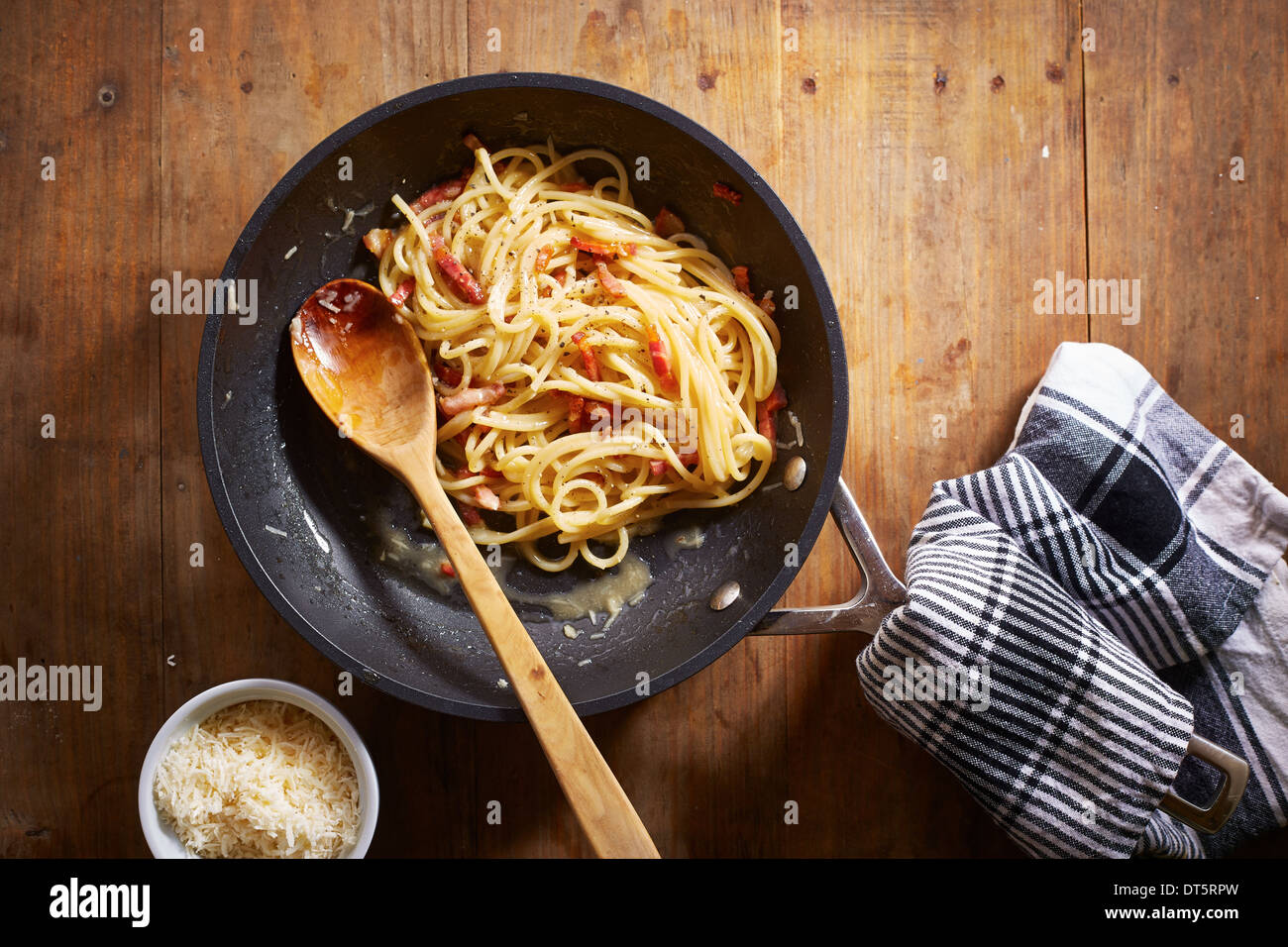 Making spaghetti a la carbonara overlook shot Stock Photo
