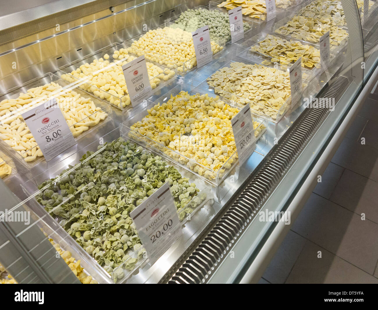 Varieties of fresh made pasta on display at an italian supermarket Stock Photo
