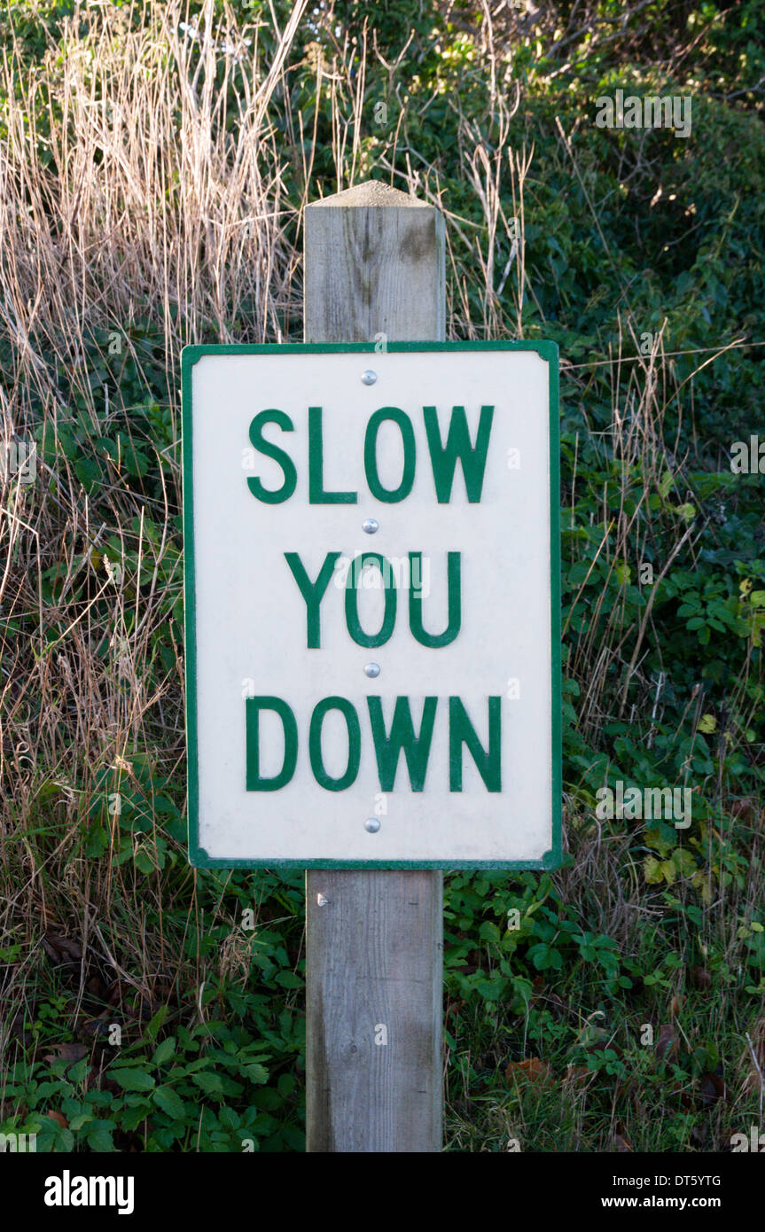 Slow You Down speed restriction sign outside Norfolk village of Weybourne. Stock Photo