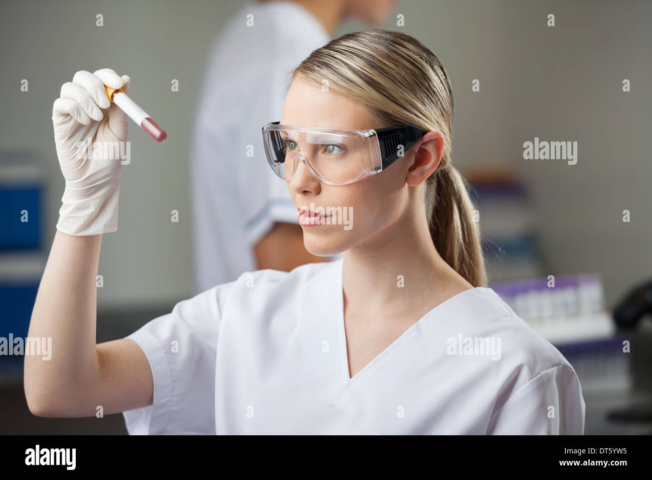 Technician Testing Blood Sample In Lap Stock Photo Alamy