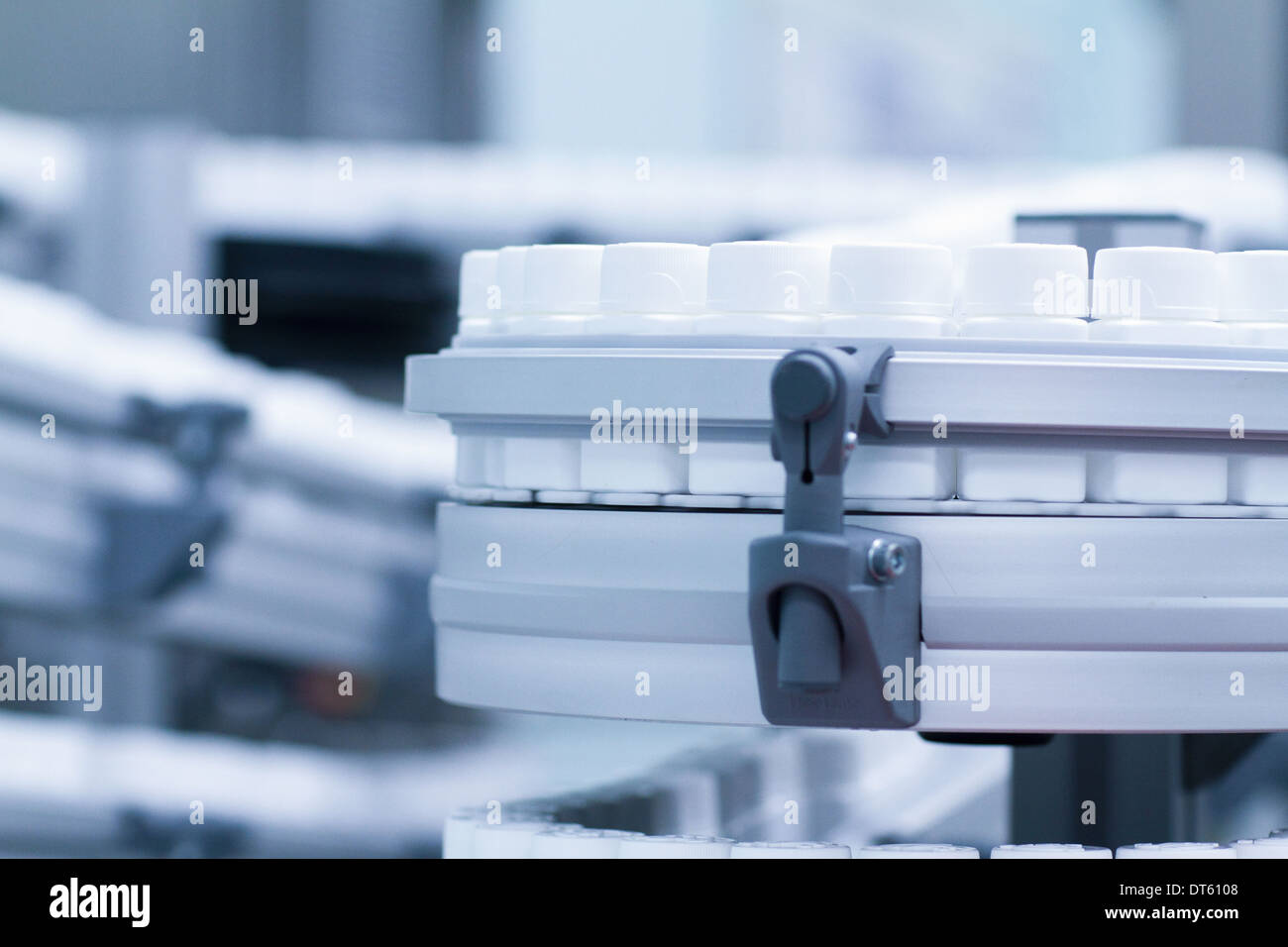Close up of carousel of pharmaceutical containers Stock Photo