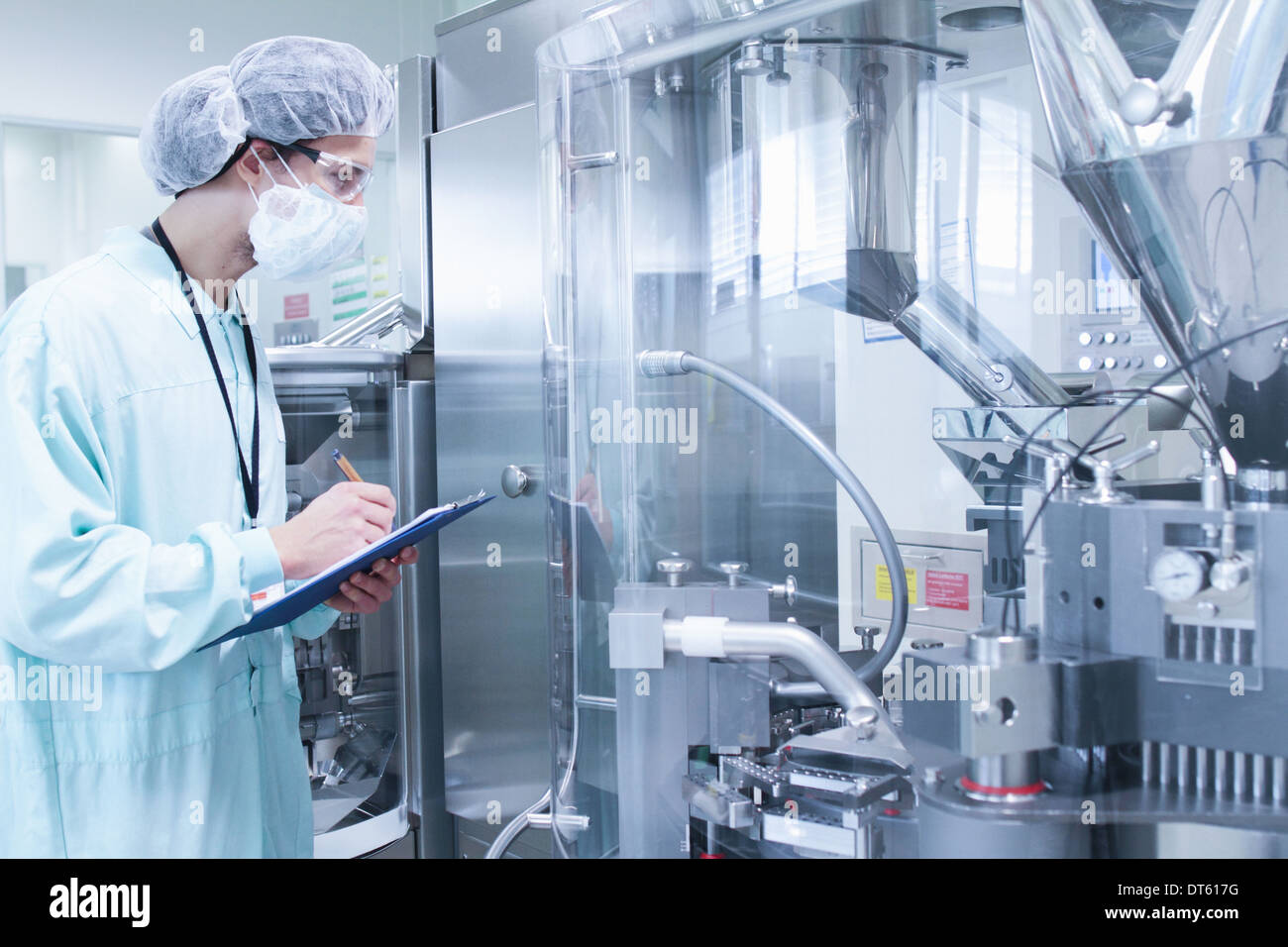 Laboratory technician writing notes Stock Photo Alamy