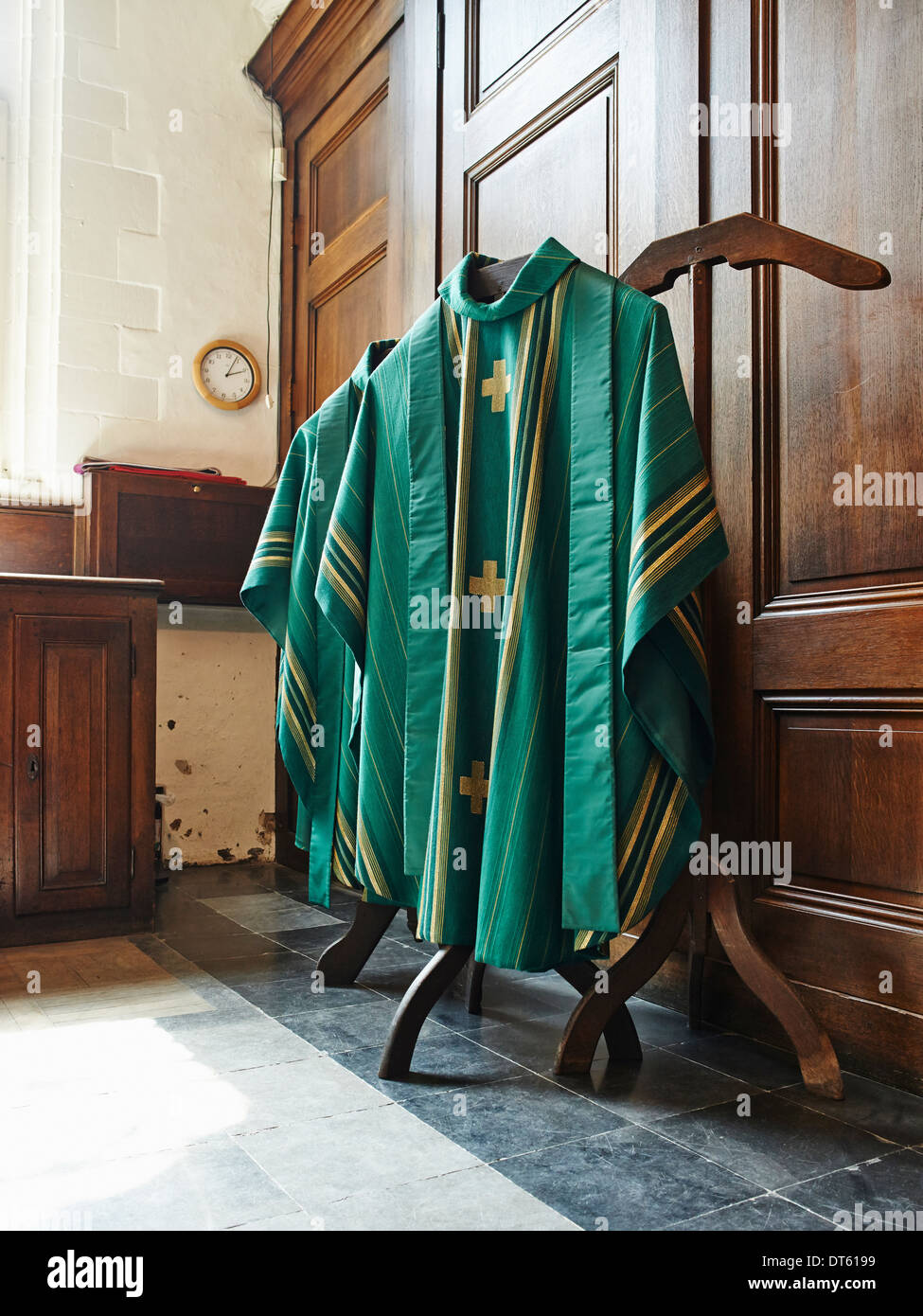 Green religious robes hanging in church interior Stock Photo