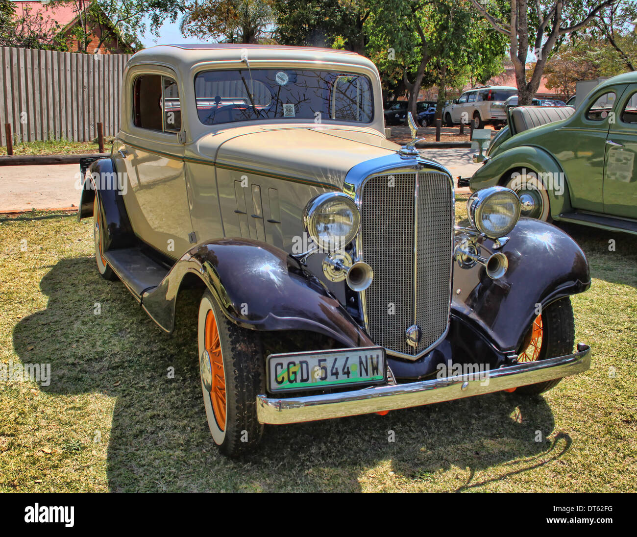 RUSTENBURG, SOUTH AFRICA - SEPTEMBER 9: A beige 1932 Chevrolet Five Window Rumble seat Coupe Stock Photo