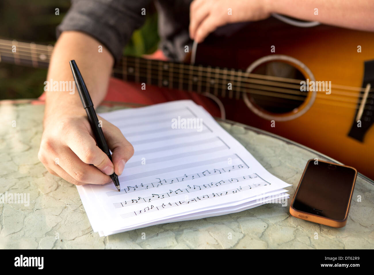Close up of young man composing music Stock Photo