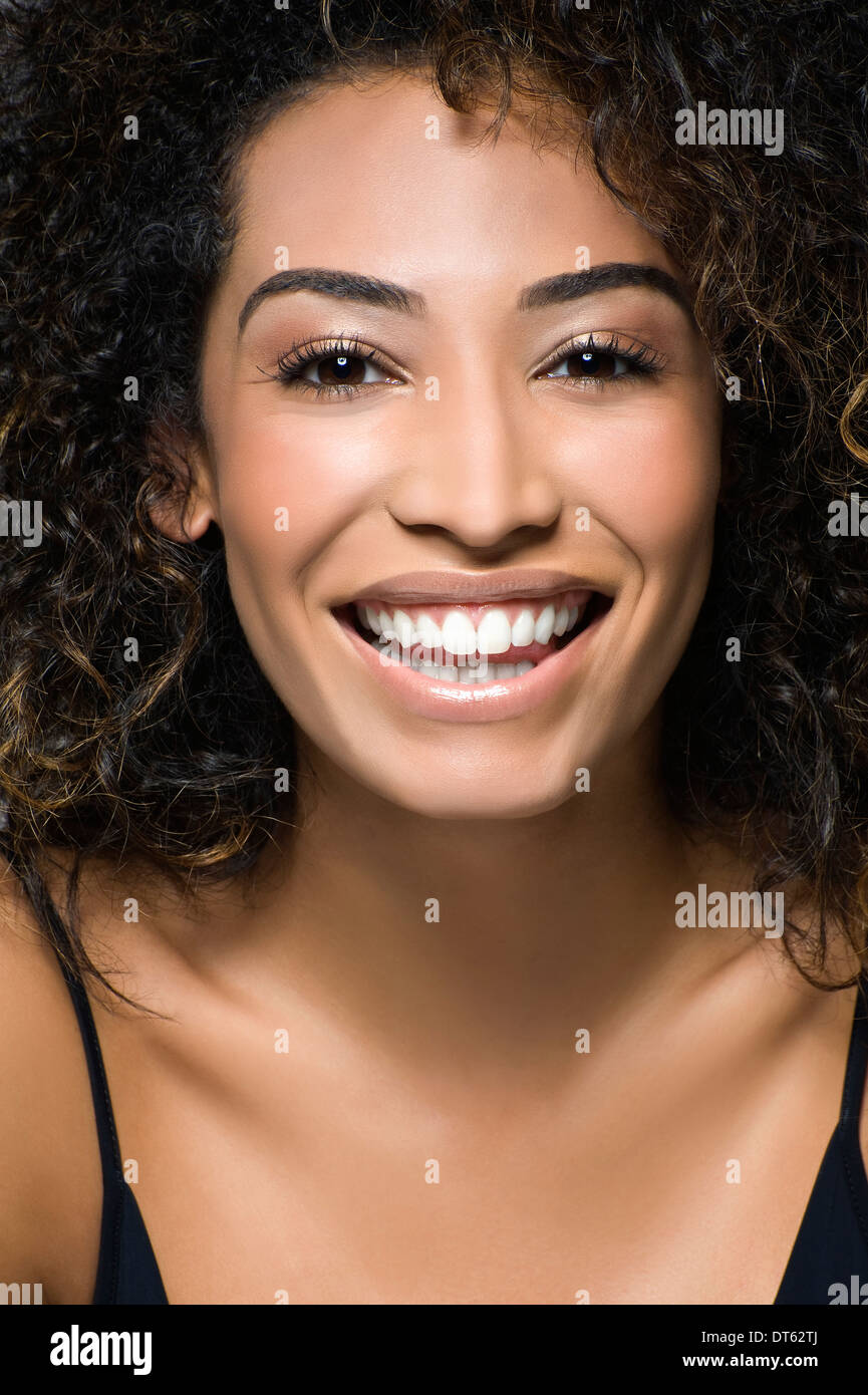 Close up studio portrait of happy young woman Stock Photo