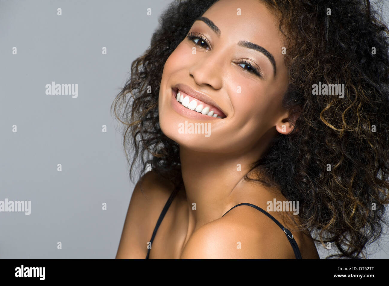 Studio portrait of beautiful happy young woman Stock Photo