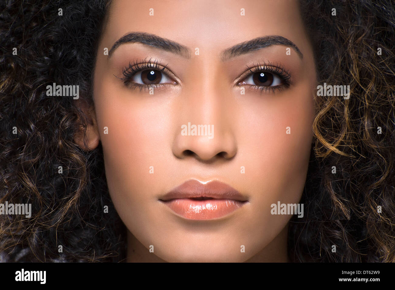 Close up studio portrait of beautiful young woman Stock Photo