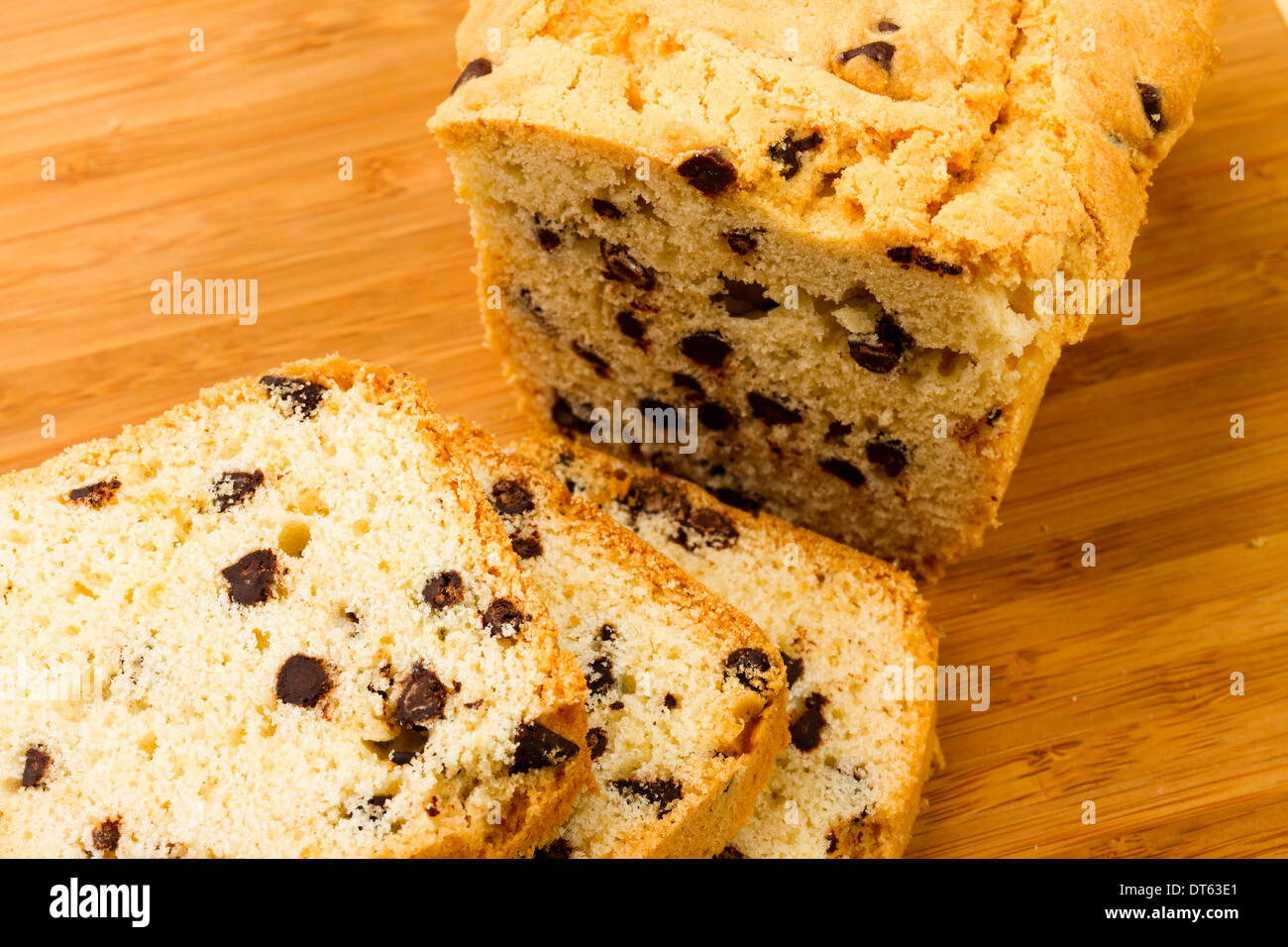 chocolate fruitcake on chopping board Stock Photo