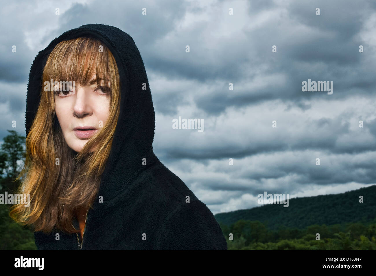 Portrait of mature woman wearing hooded top Stock Photo