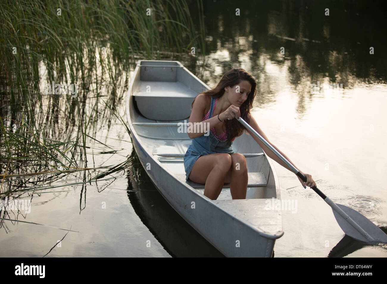 Teenage girl boating in the evening Stock Photo Alamy