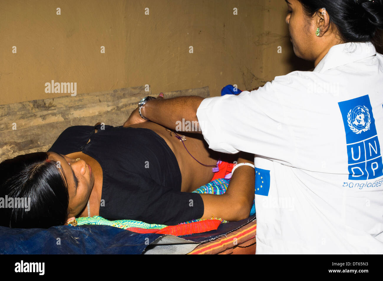 Bangladesh, South Asia, Chittagong, Khagrachari, Pregnant mother being examined by UNDP nurse. Stock Photo