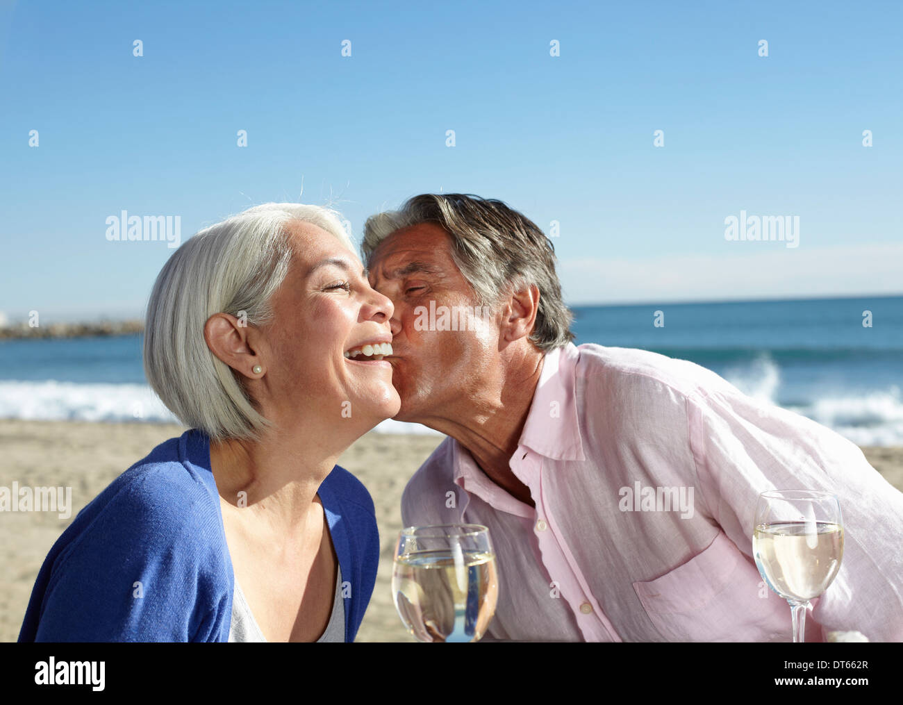 Old woman and young man kissing hi-res stock photography and images - Alamy