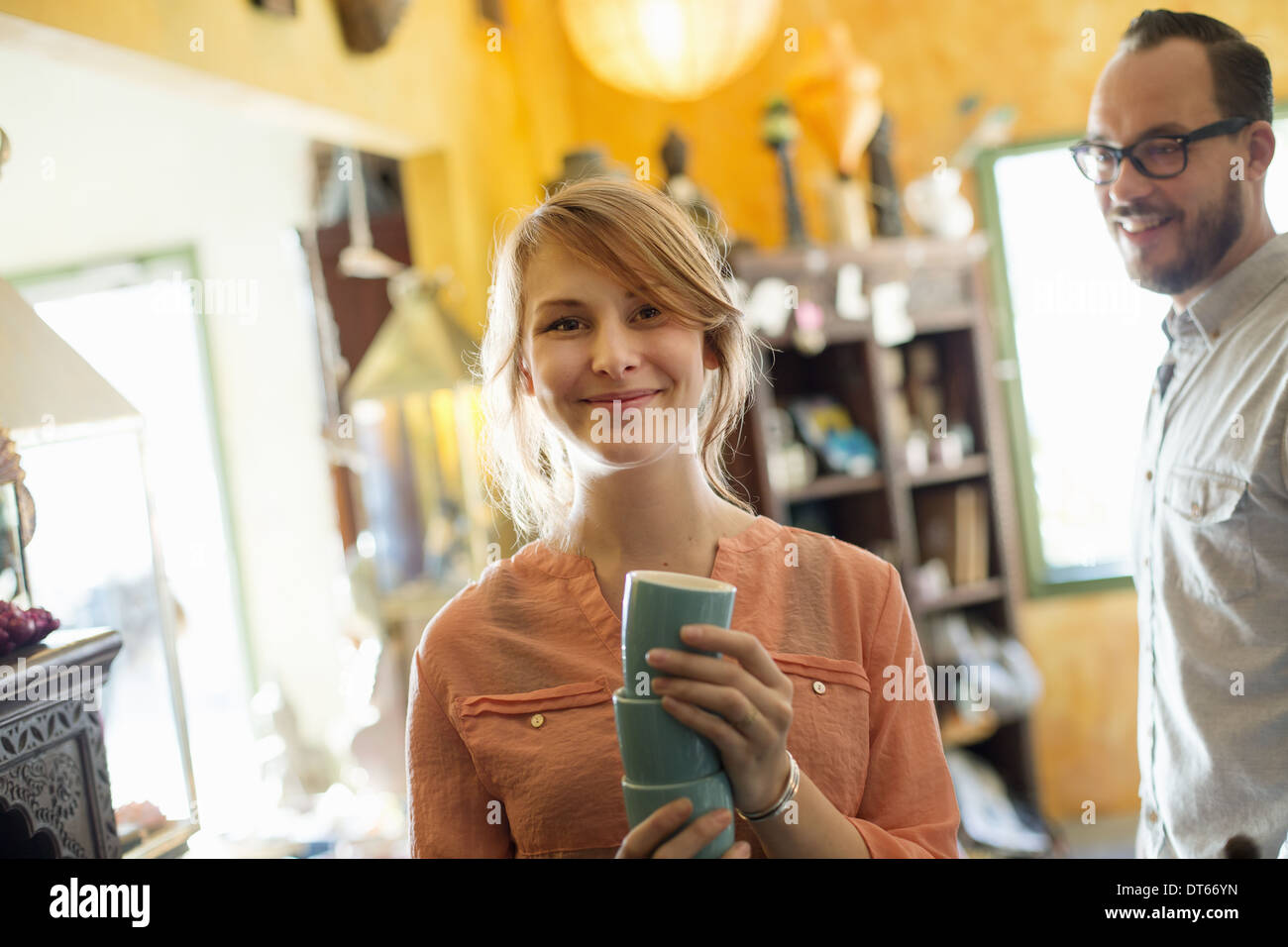 A man and woman, a couple running a business. An antique store. Stock Photo
