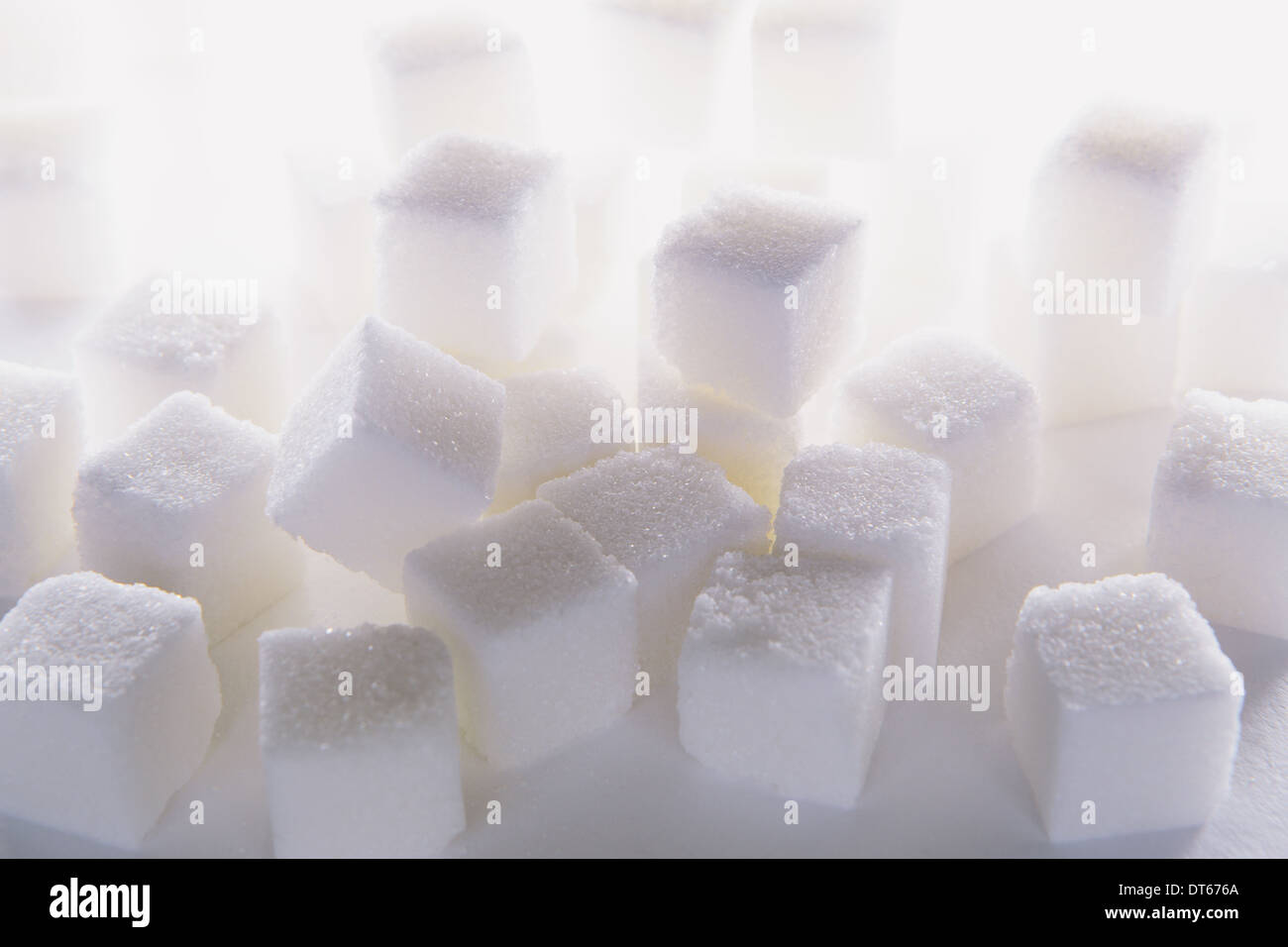 Sugar cubes on white backdrop Stock Photo