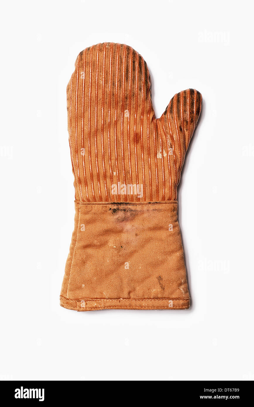Used Oven Mitt. An orange fabric heat resistant mitt. Stock Photo