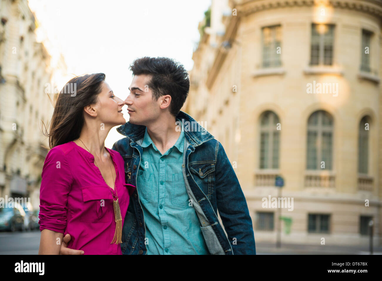 Young couple kissing on street, Paris, France Stock Photo