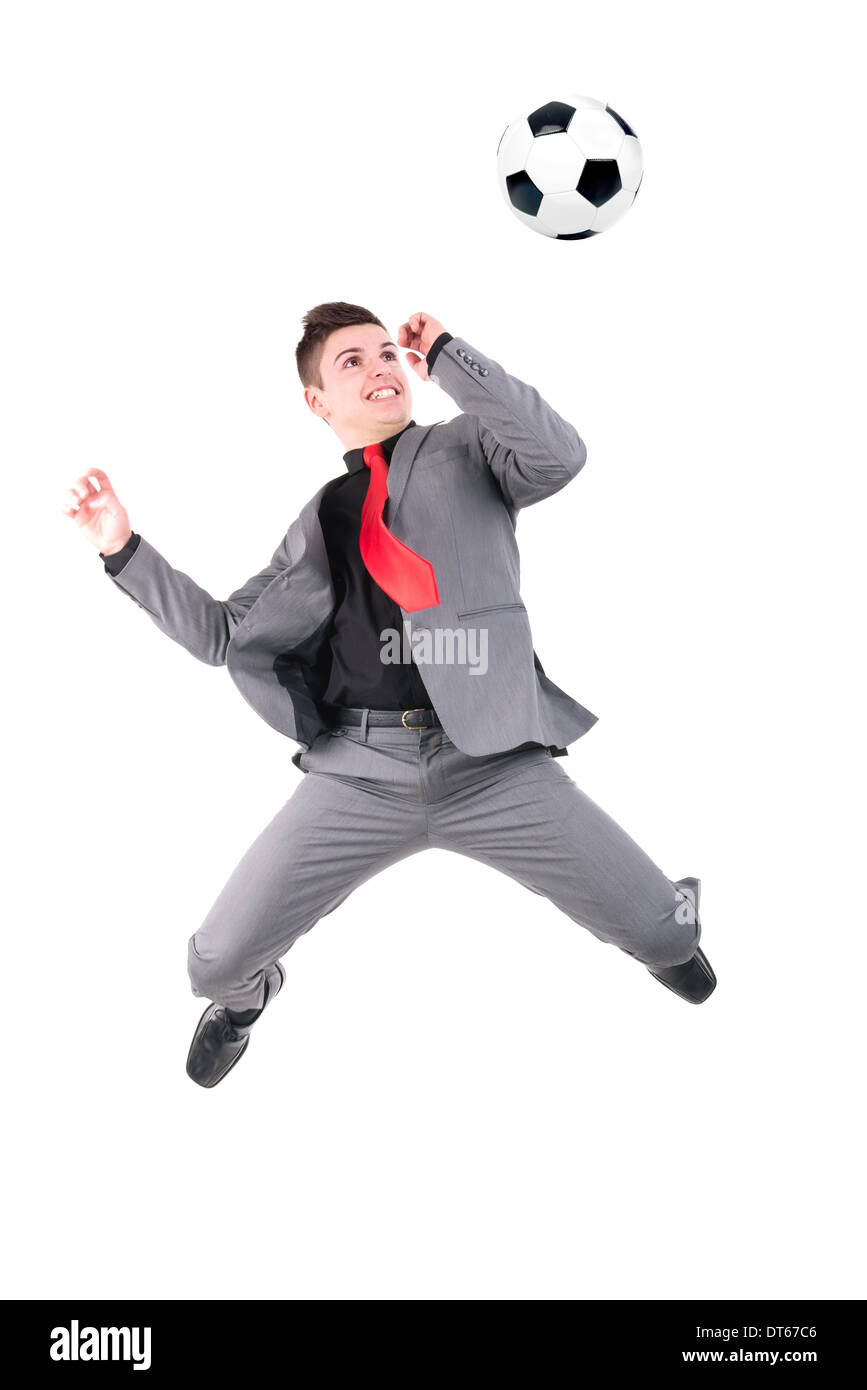 Businessman playing soccer ball isolated in white Stock Photo - Alamy