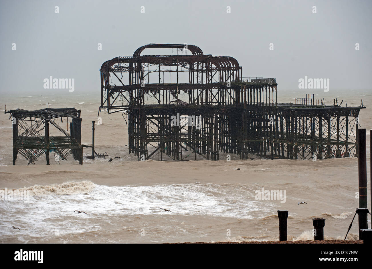 High winds and storms battered Brighton's West Pier causing another big chunk to fall from the already precarious structure Stock Photo