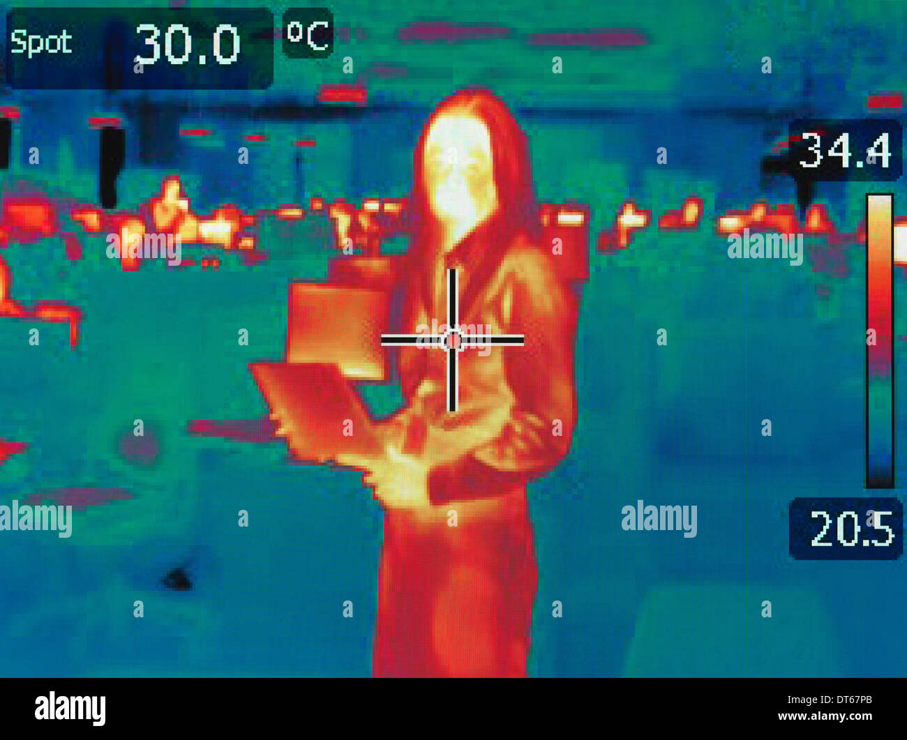 Infrared heat image of office worker Stock Photo