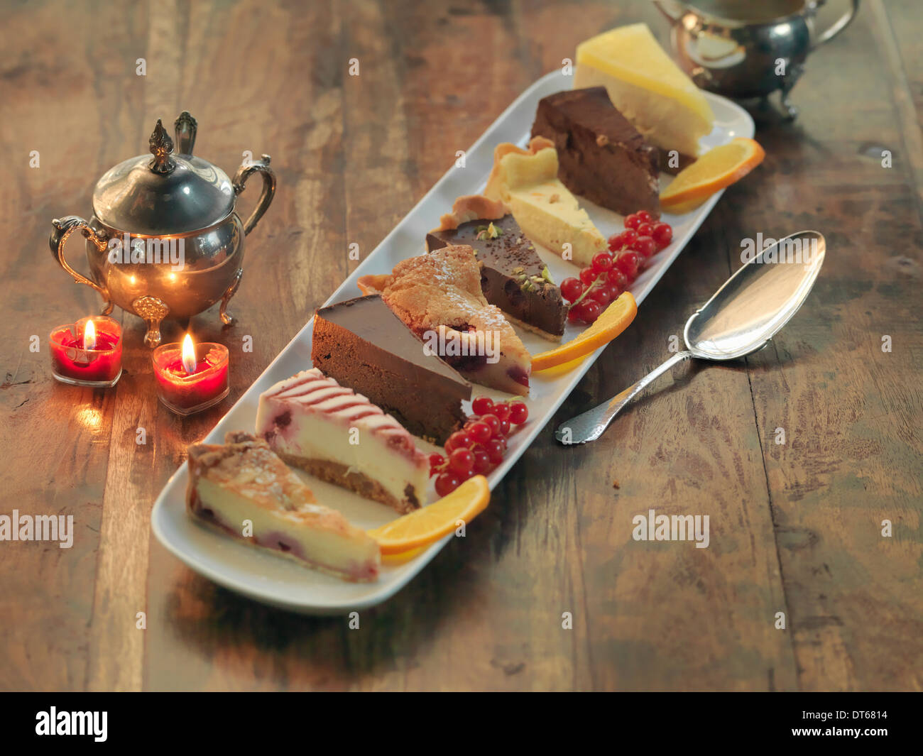 Mixed platter of cakes and tarts amongst festive decorations Stock Photo
