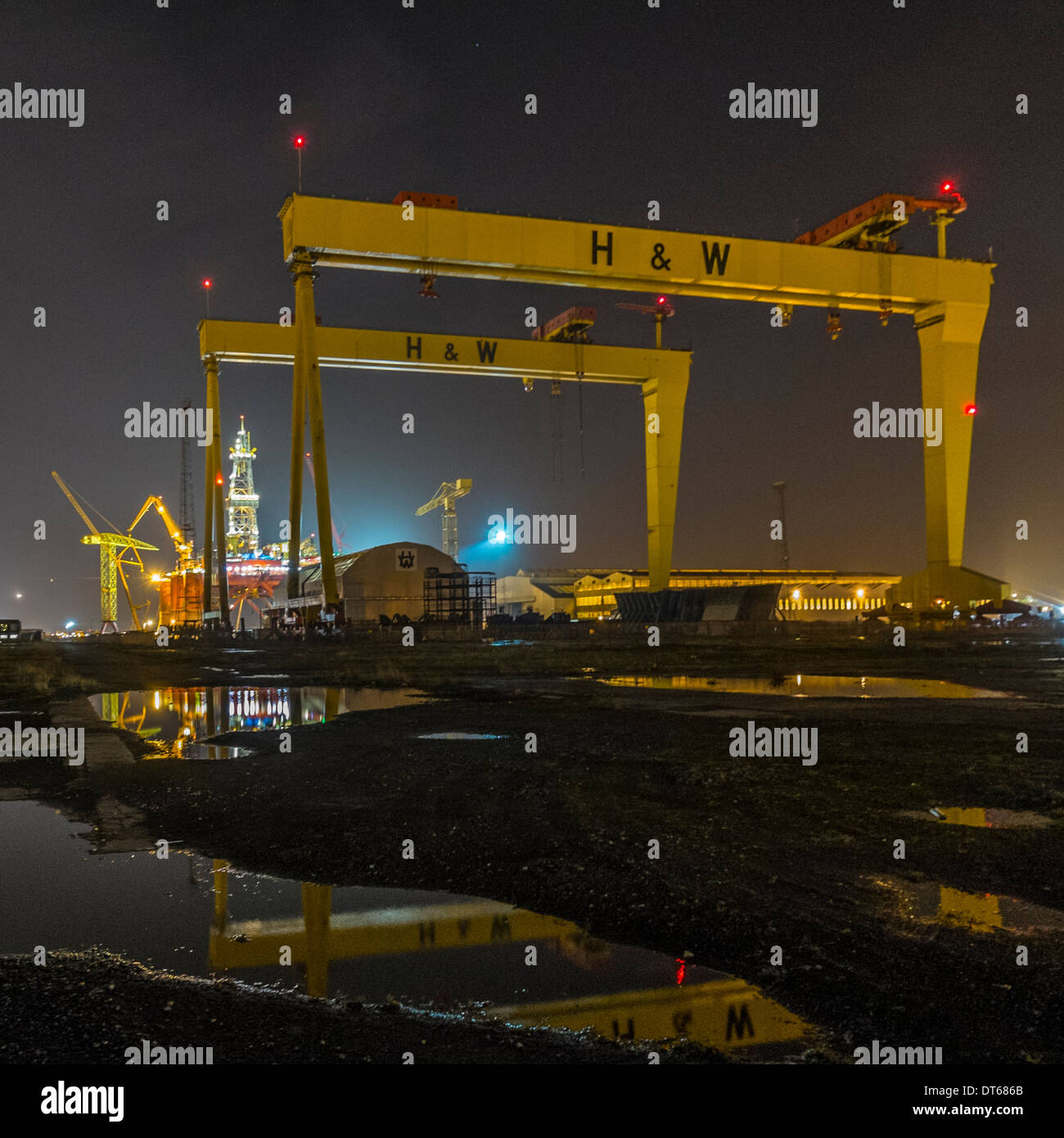 A night time view of shipyard cranes, nicknamed Samson and Goliath, in Harland and Wolff Shipyard, Belfast. Stock Photo