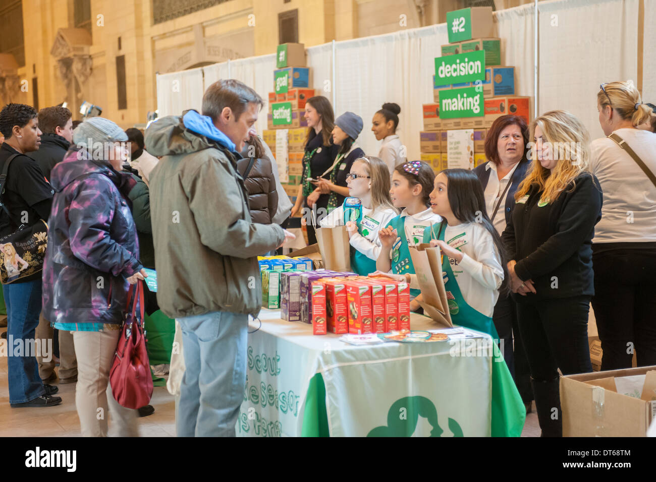 Girl Scouts mark the start of National Girl Scout Cookie Weekend in Vanderbilt Hall in Grand Central Terminal in New York Stock Photo